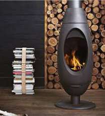 Печь-камин Invicta OVE стальная в интерьере Амазонка бай фото в Слониме