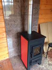 Купить стальной камин Везувий ПК-01 (270) в Слониме фото в интерьере в Слониме