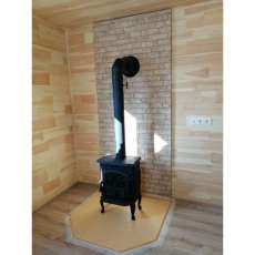 Чугунный камин со стеклом Сибирь 7 фото в интерьере в Слониме