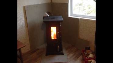 Отопительная печь Термофор Статика Тетра, чёрная бронза фото в интерьере в Слониме