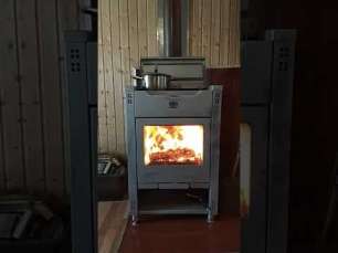 Стальной камин со стеклом Теплодар Кадриль фото в интерьере в Слониме