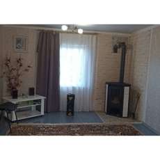 Стальной камин с шамотом Мета-Бел Ритм L фото в интерьере в Слониме