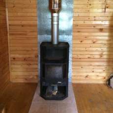 Печь-камин с шамотом Мета-Бел Ангара-Аква в интерьере фото в Слониме