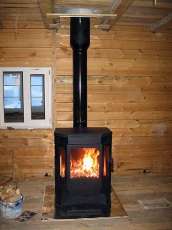 Печь-камин Бавария водяной с плитой в интерьере в Слониме