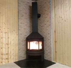 Стальной камин Бавария Мюнхен угловой чёрный (без перемычки) фото в интерьере в Слониме